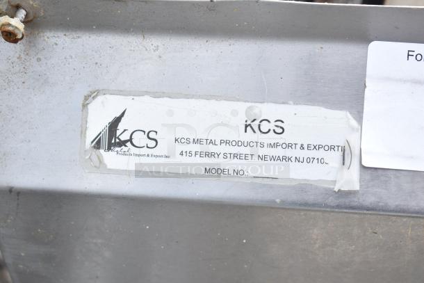 Commercial 3 bay sink by KCS Metal Products. Manufacturer label on the side, some visible wear. Model No. area blank.