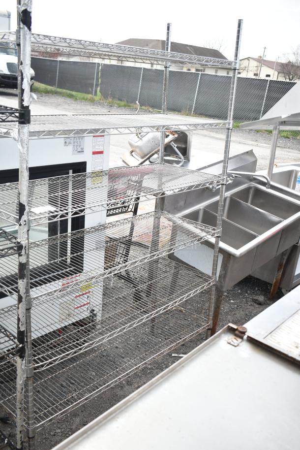 Chrome finish 6-tier wire shelving unit, sturdy condition, ideal for storage. Buyer dismantling required for shipping.