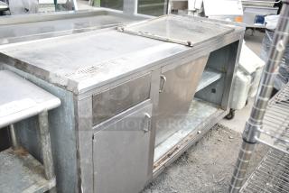 Commercial soda station with under shelves and doors, stainless steel, used condition, sturdy with visible wear.