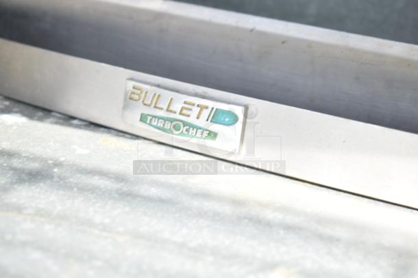 Commercial soda station with under shelves and doors. Bullet TurboChef branding visible on metal exterior.