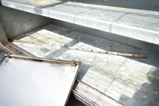 Commercial soda station with under shelves and doors, showing signs of rust and wear, suitable for refurbishment.