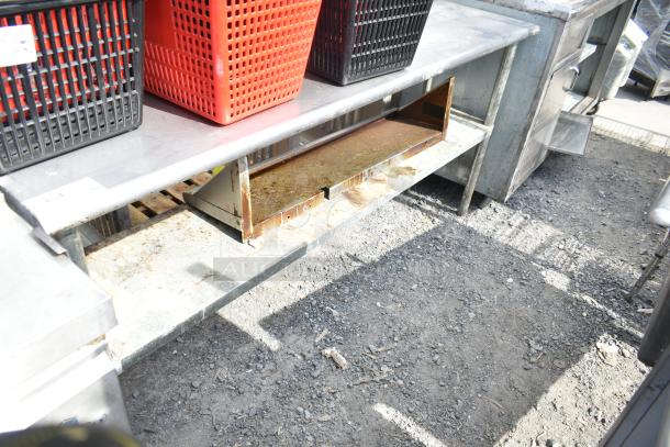 Commercial 2-tier metal overshelf with storage baskets. Worn condition with rust on lower shelf. Includes red and black baskets.