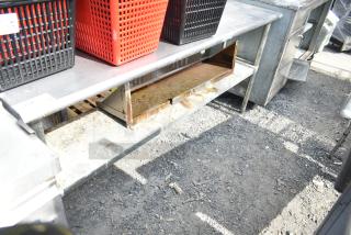 Commercial 2-tier metal overshelf with storage baskets. Worn condition with rust on lower shelf. Includes red and black baskets.