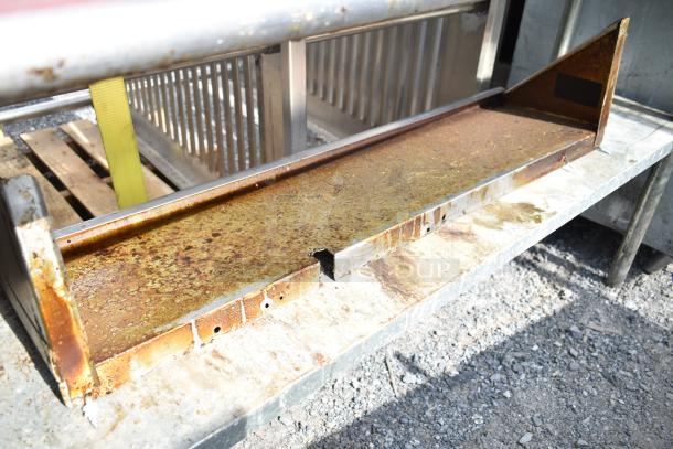 Commercial 2-tier over shelf with rusted surface, includes storage baskets; visible signs of wear.