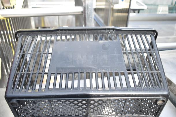 Black poly basket with slotted design, excellent condition. Auction includes 18 baskets, bid multiplies by 18.