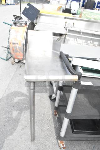 Commercial left-side clean side dish table in metal, sturdy design. Includes splash guard, ideal for kitchen sanitation.