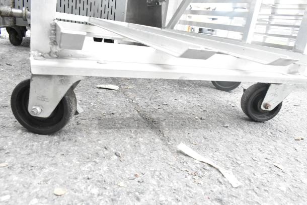 Commercial #10 can rack with sturdy metal frame, equipped with durable commercial casters for easy mobility.