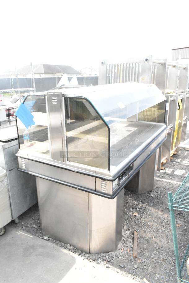 Henny Penny HMI-105 HI-5 Heated Island Merchandiser Display Case, stainless steel, curved glass front, 120/208V, 1 Phase.