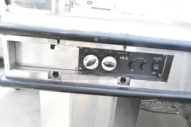 Henny Penny HMI-105 HI-5 heated display case with controls visible. 120/208V, 1 phase, used condition.
