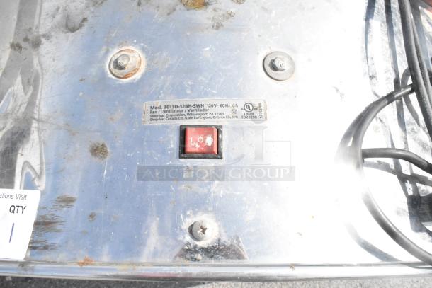 Rusty metal base of Shop Air 3613D-12BH-SWH floor fan with power switch, label detailing 115V, 1 phase, and UL certification.