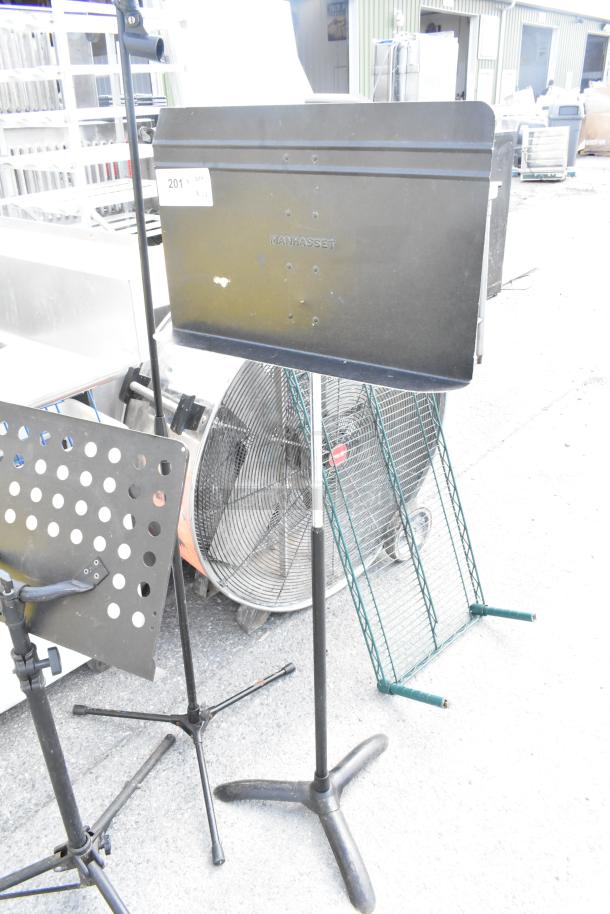 Three Manhasset music stands, black, adjustable height, sturdy tripod bases, used condition with minor wear, sale includes all three.