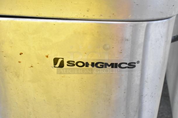 Songmics trash can with visible brand logo, metallic finish, minor surface marks, auction includes a tray, bid doubles value.