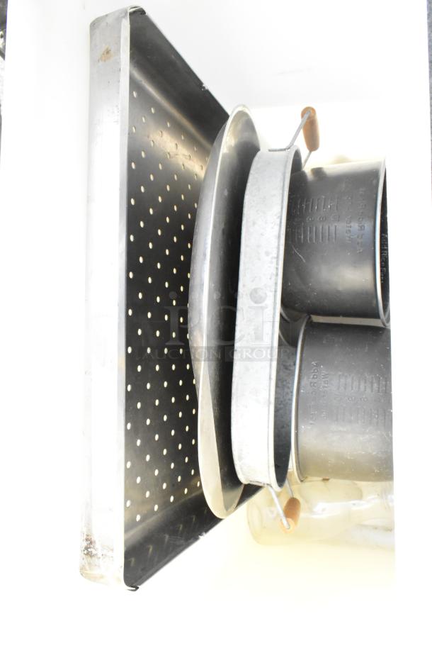 Poly trash can containing various metal pans and containers, some with labels and handles, indicating mixed contents.