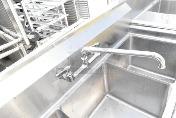 Commercial 3 bay sink, stainless steel, dual faucets, excellent condition, ideal for restaurant use.