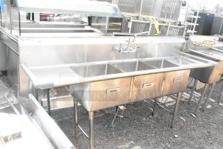 Commercial 3-bay sink with dual drain boards, stainless steel, labeled "Wash," "Rinse," "Sanitize," includes faucet.