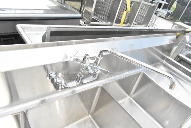 Commercial 3 bay sink with dual drain boards, stainless steel, single faucet, excellent condition, ideal for kitchens.