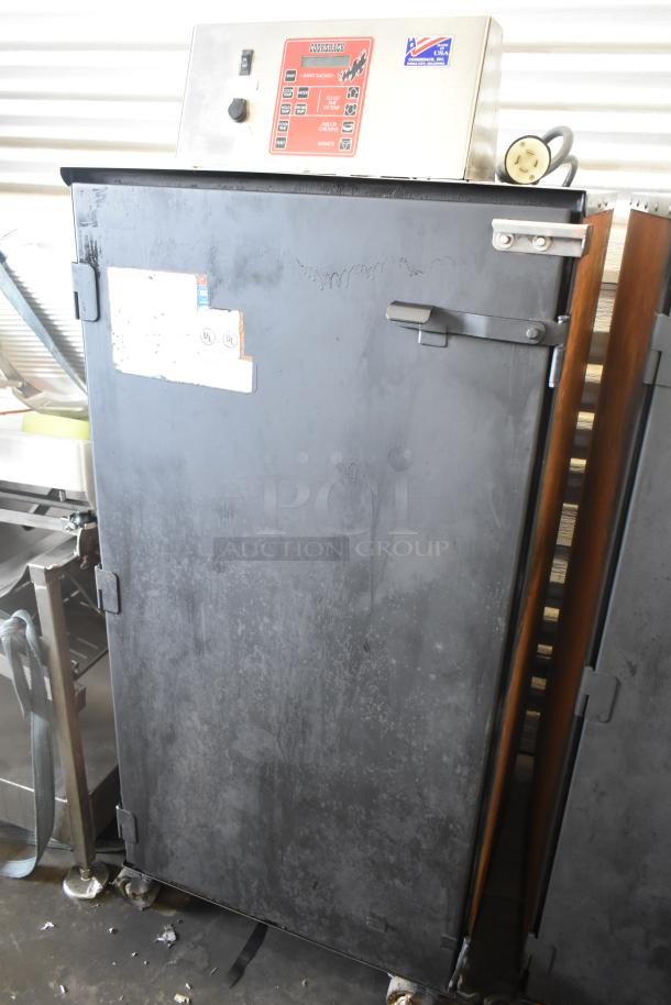 Cookshack 250 commercial electric smoker cabinet with control panel, on casters. Visible wear, 208 volts.