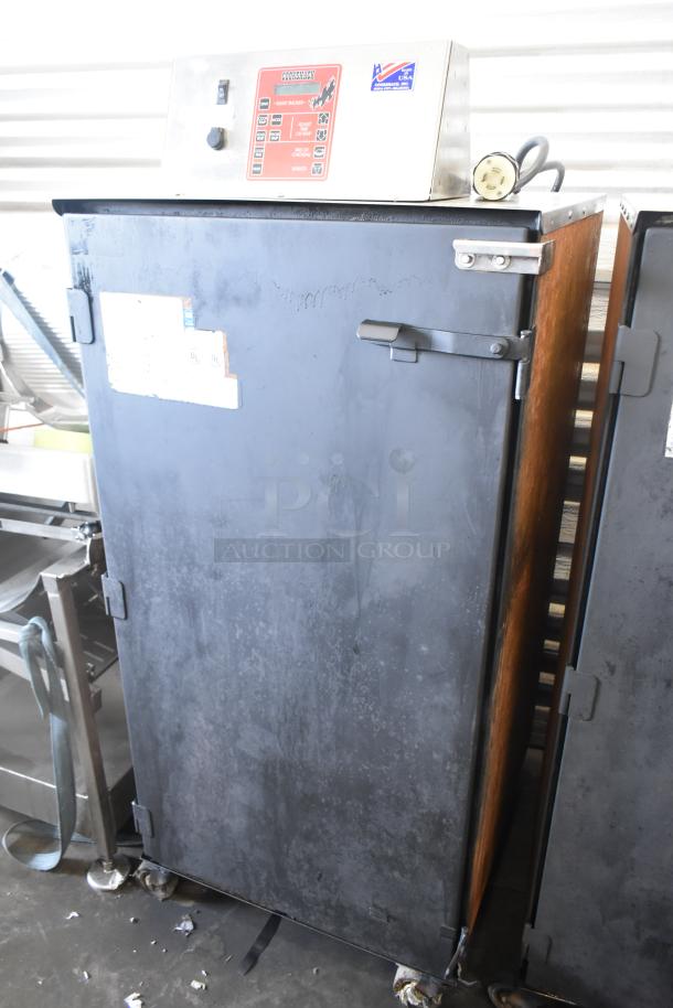Cookshack 250 Commercial Electric Smoker Cabinet, 208 Volts, with commercial casters. Visible controls and labels on top panel.