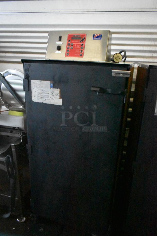Cookshack 250 electric smoker cabinet with control panel, commercial casters, 208V, steel finish, used condition.