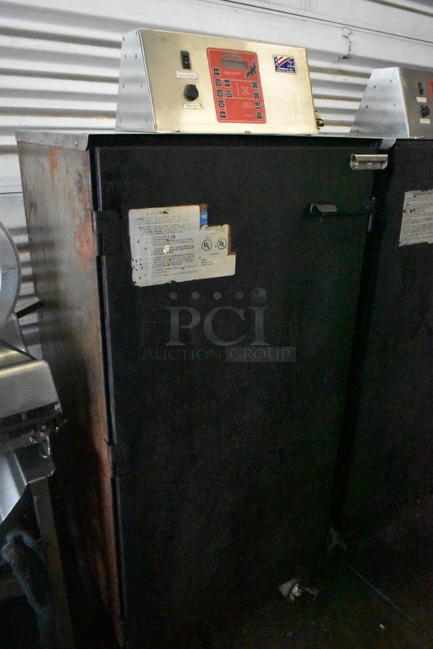 Cookshack 250 Commercial Electric Smoker Cabinet with control panel, 208 volts, on casters, showing wear.