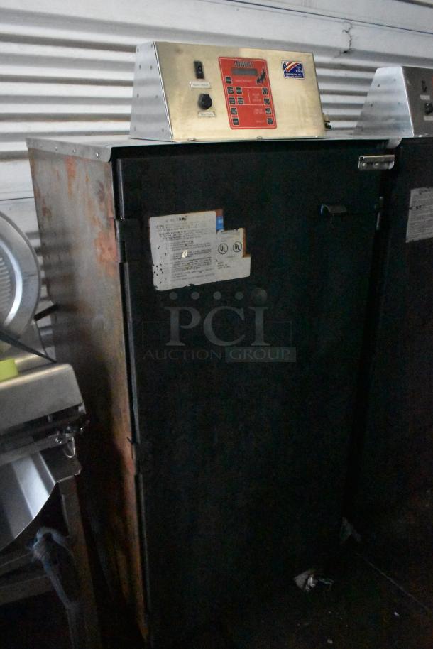 Cookshack 250 Commercial Electric Smoker Cabinet, 208V, on commercial casters. Worn exterior, visible control panel and safety labels.