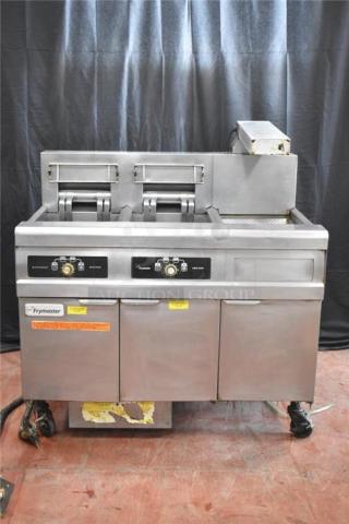 Frymaster FMRE217SC 2-bay electric fryer with dumping station, filtration system, and commercial casters. Good condition.