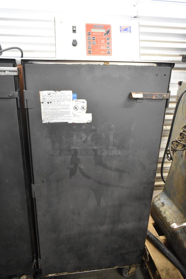 Cookshack 250 Commercial Electric Smoker Cabinet with control panel, UL labels, on casters, powered at 208 volts.