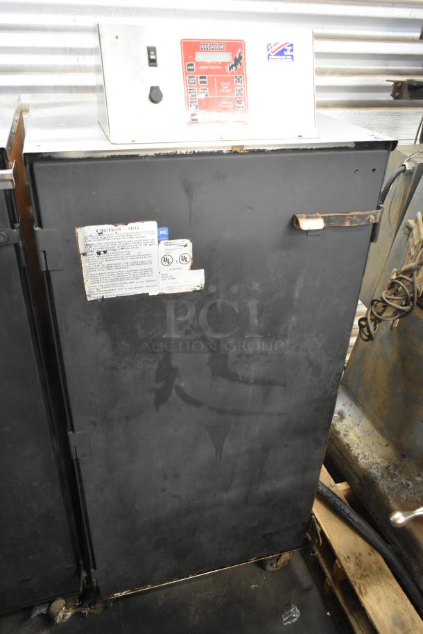 Cookshack 250 Commercial Electric Smoker Cabinet with control panel and casters, 208 volts, used condition, visible safety labels.
