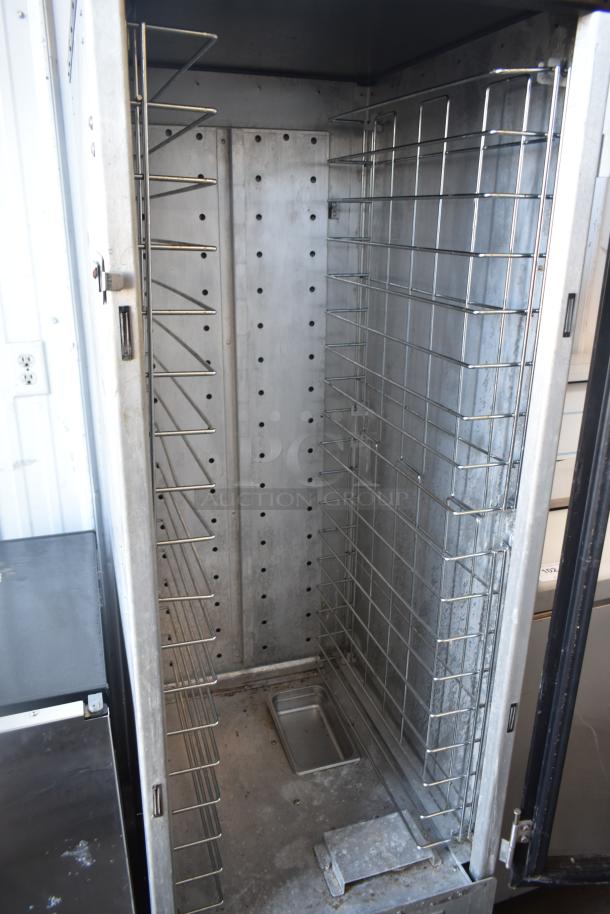 Metro HM2000 heated holding cabinet on casters, 115 volts, 1 phase. Commercial use, metal racks, interior view.