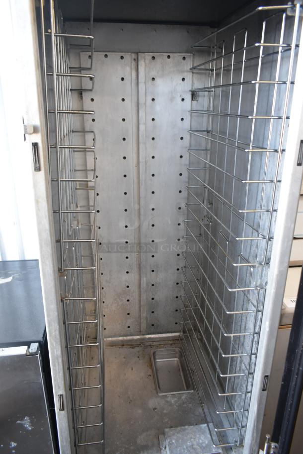 Metro HM2000 Heated Holding Cabinet, 115V, commercial casters, stainless shelves, good condition, interior view.