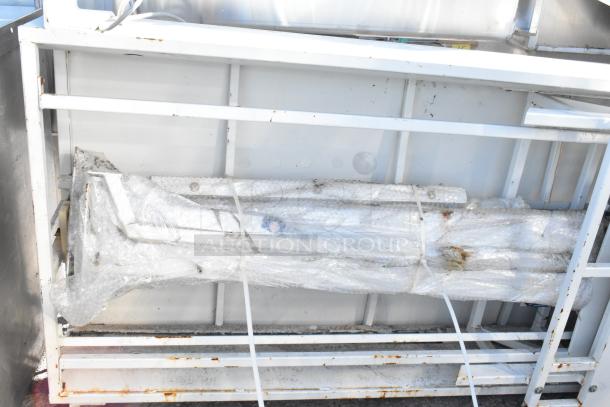 Control panel with two Telemecanique Osiswitches wrapped in bubble wrap, secured on a metal frame. Condition appears used.