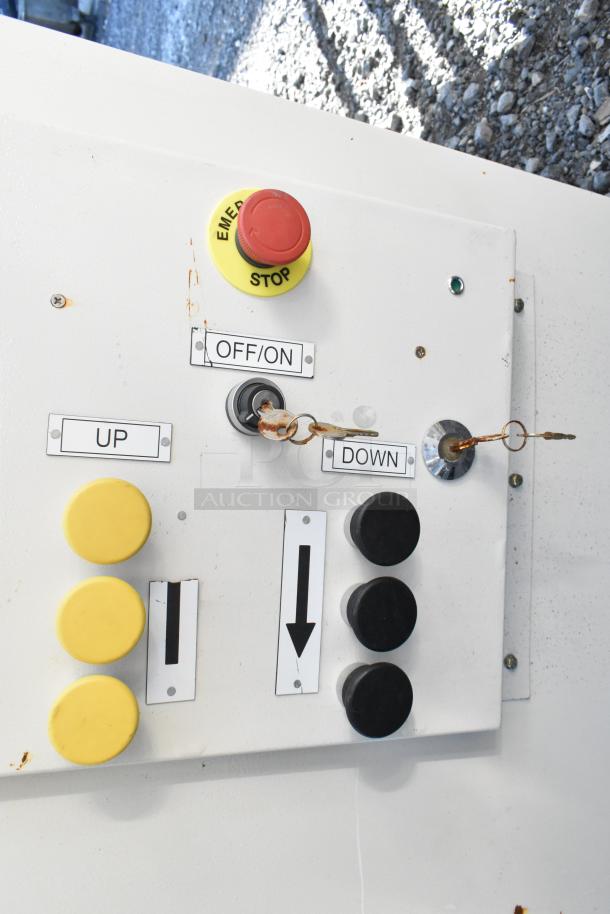 Control panel with two Telemecanique Osiswitches, featuring emergency stop, up/down buttons, and on/off key switch. Good condition.