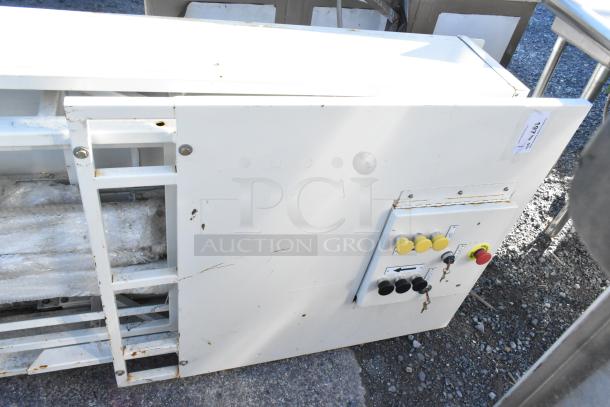 White control panel with two Telemecanique Osiswitches, various colored buttons, and visible scratches on the surface.