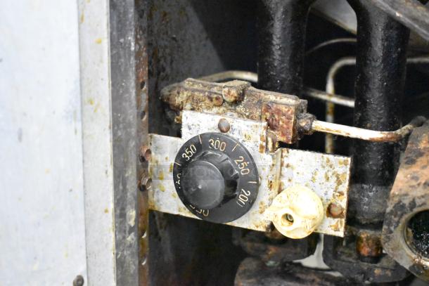 Pitco Frialator gas deep fat fryer thermostat, showing temperature settings from 200 to 350 degrees, in used condition.