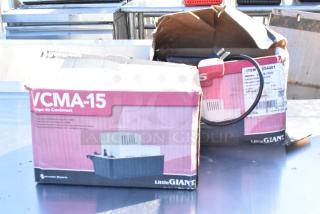 Two Little Giant VCMA-15 condensate removal pumps in original boxes, partially visible wiring, model number on label.