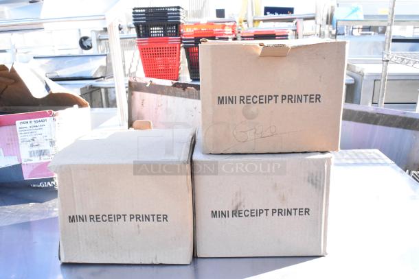 Three boxed Rongta Sam4S mini receipt printers on a metal surface, labeled "MINI RECEIPT PRINTER." Boxes appear intact.