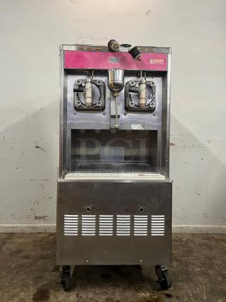 TAYLOR 342D double flavor frozen drink machine for margaritas or milkshakes, stainless steel, on casters, Dunkin' Donuts branding.