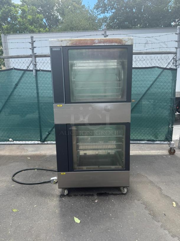 HOBART HRW 303 electric rotisserie oven and warmer. Dual glass doors, stainless steel, on wheels, electrical cord visible.