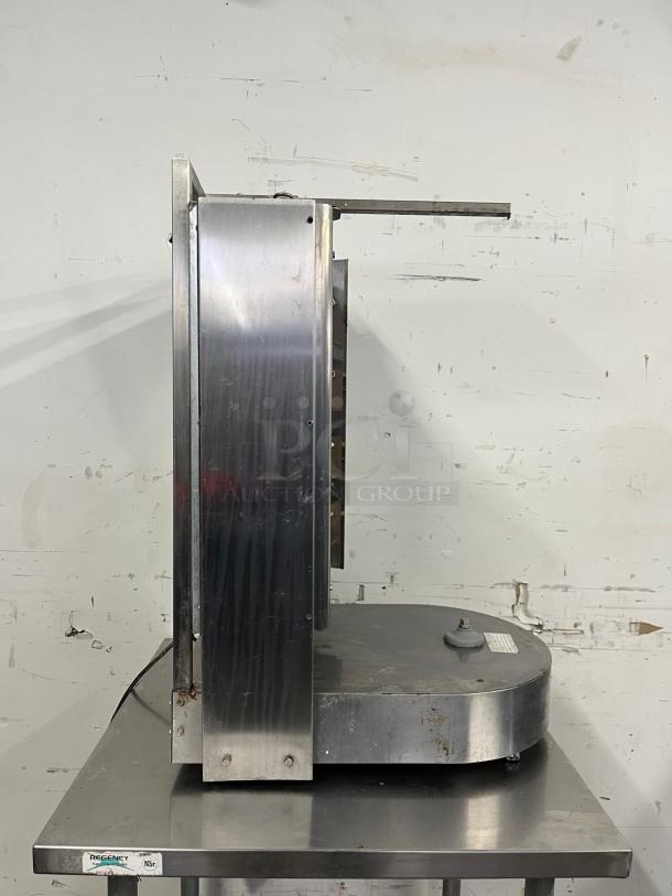 INOKSAN PDG 400N doner kebab machine, natural gas with mesh shield, 132-165 lb. capacity, used condition, side view.