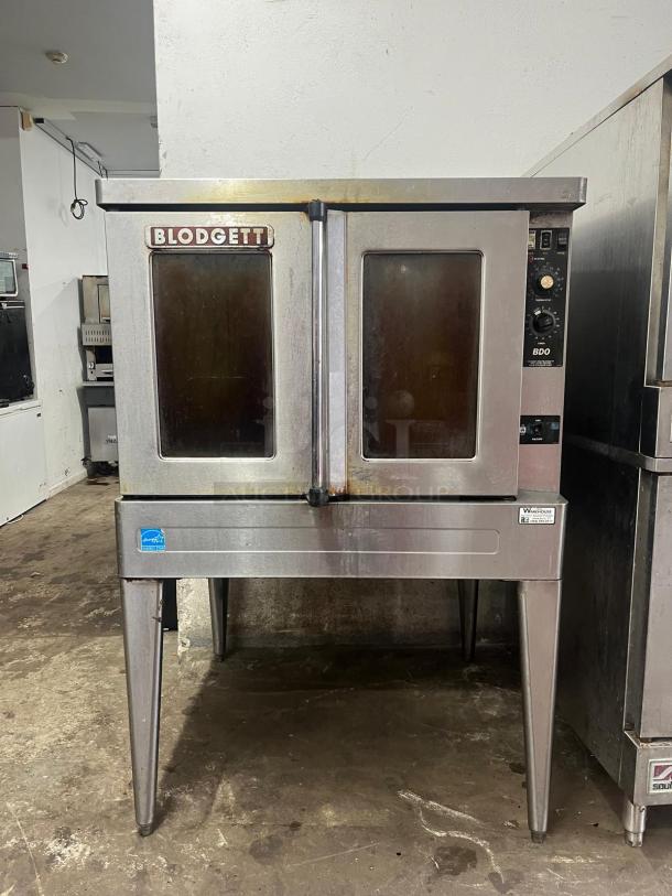 Blodgett BDO-100-G-ES convection oven, dual glass doors, visible wear, control panel intact, stainless steel finish.