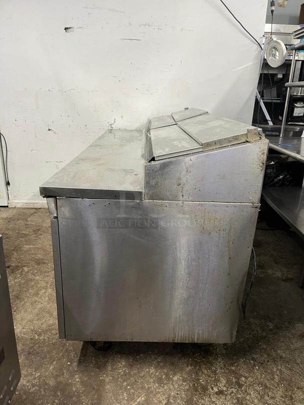 RANDELL Model 8383N pizza prep table, stainless steel, 1 door, 4 drawers, good condition, minor surface wear.