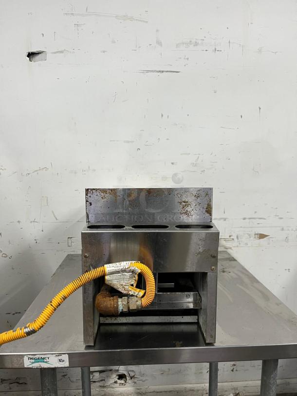 SIERRA SRMG-12 countertop gas griddle, 30,000 Btu, 12", manual controls, visible wear, connected gas line.