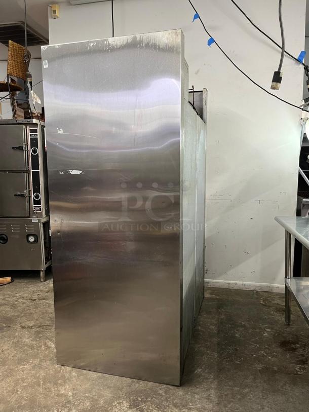 TRAULSEN RHT232NUT-HHS stainless steel 46 Cu. Ft. two-section half-door narrow reach-in refrigerator. Specification Line.