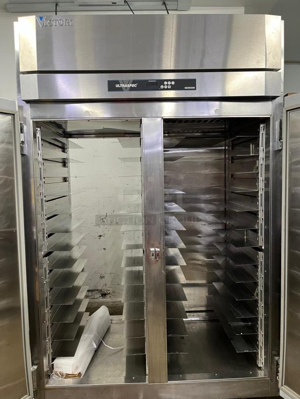 VICTORY ULTRASPEC high roll-thru refrigerator, solid front/rear doors, stainless steel, spacious interior, excellent condition.