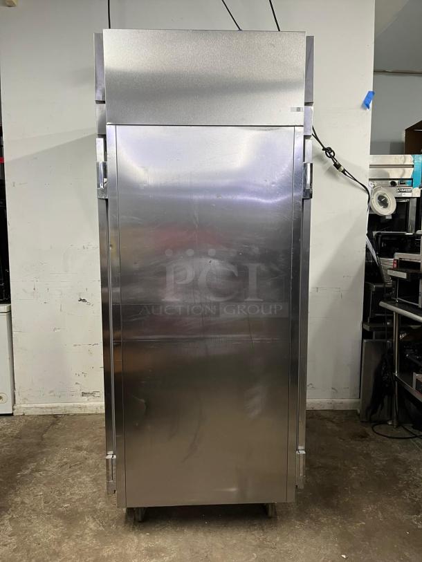 VICTORY ULTRASPEC roll-thru refrigerator with front and rear solid doors, stainless steel, used condition.