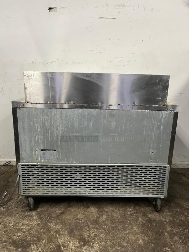 Blue Air BLMT48-HC 48" refrigerated sandwich prep table, used condition, features two swing doors, 13.1 Cu. Ft. capacity.
