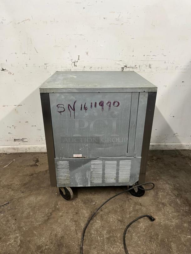Beverage-Air 27" undercounter refrigerator with visible wear and serial number 3N1411990 on metal exterior.