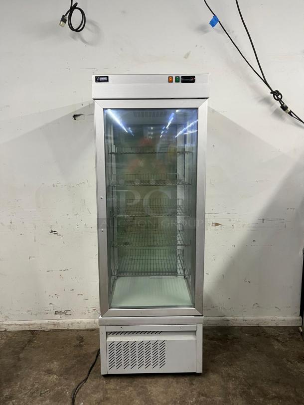 TEKNA 4400 NFP 4-sided glass refrigerated display case in good condition, featuring adjustable wire shelves.