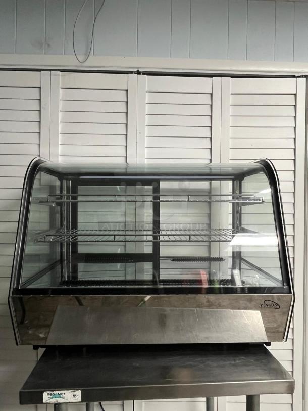 SWEET Yukon refrigerated display case RTW-160, curved glass, two shelves, excellent condition, Yukon logo visible.