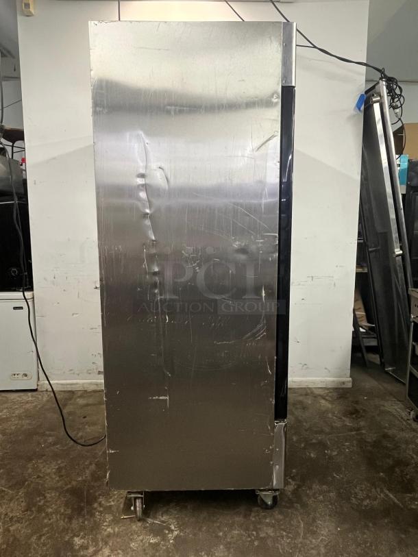 NORTH AMERICAN Precision Series A2GDF double glass door merchandiser freezer, visible wear, casters, commercial use.